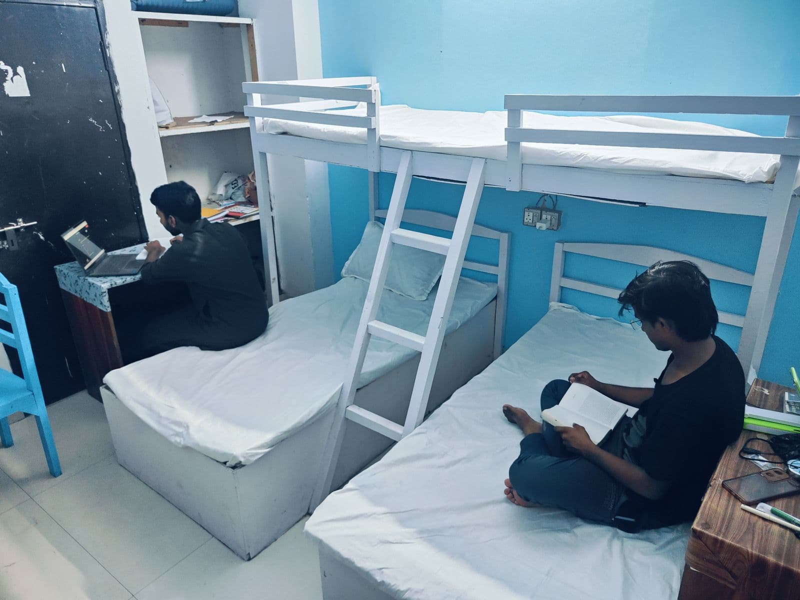 A furnished shared room at Khan Group of PG